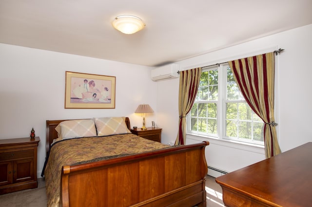 2181 Service Rd, West Barnstable, MA 02668 - bedroom with baseboard heating, a wall unit AC, and carpet flooring