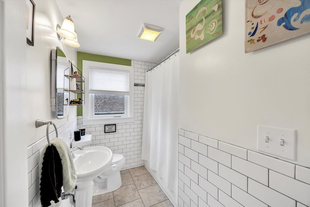 full bathroom featuring toilet, tile walls, and a shower with curtain