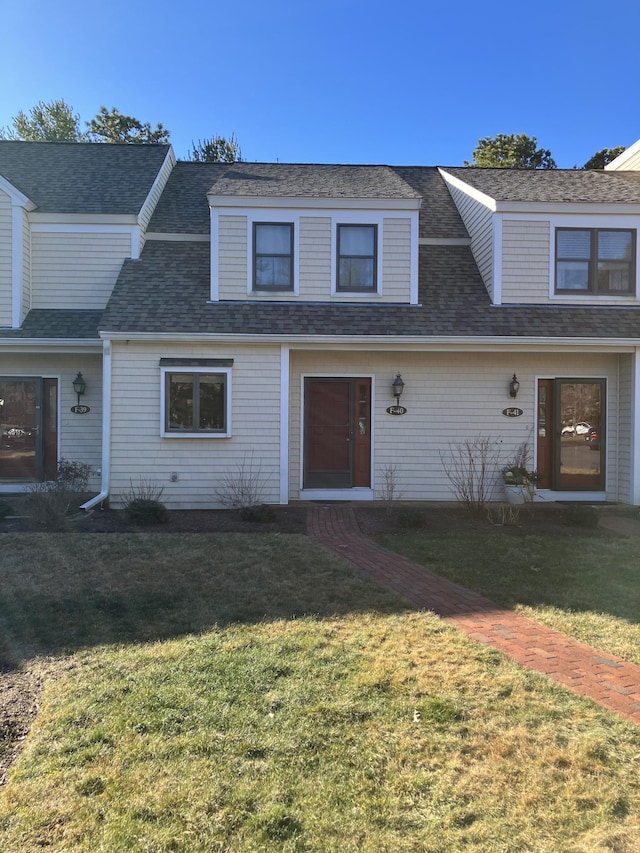 view of property featuring a front yard