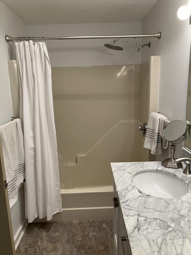 bathroom with vanity and shower / bath combination with curtain