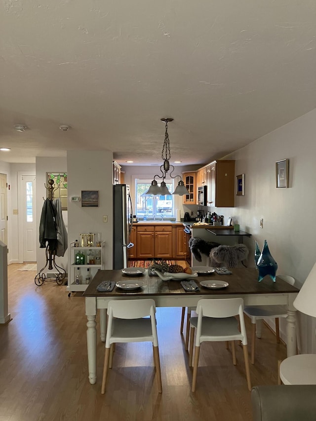 dining area with light hardwood / wood-style floors