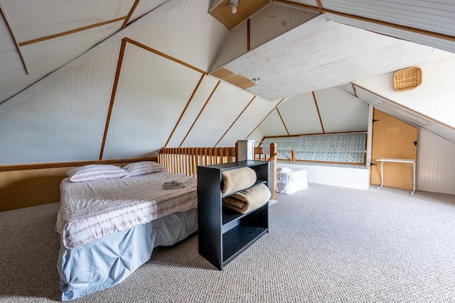 bedroom with lofted ceiling and carpet floors