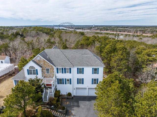 aerial view featuring a wooded view