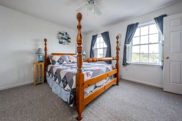 carpeted bedroom with baseboards and ceiling fan