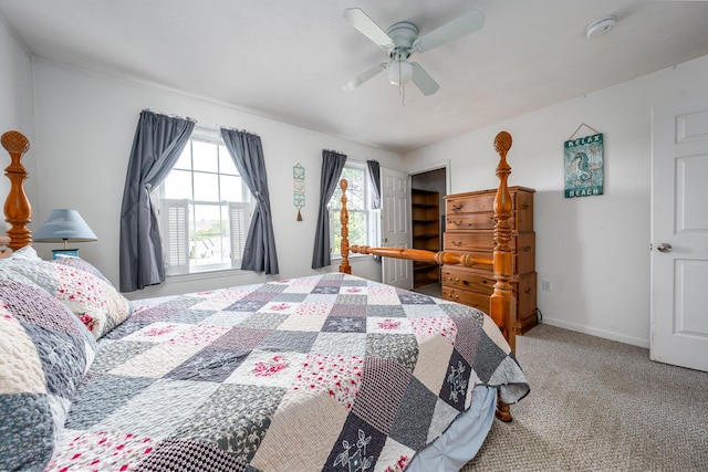 carpeted bedroom with baseboards and ceiling fan