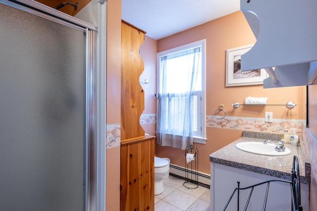 bathroom featuring tile patterned floors, toilet, a stall shower, a baseboard heating unit, and vanity