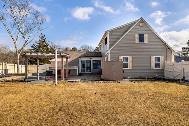 back of property featuring a lawn, a pergola, a patio area, and a fenced backyard