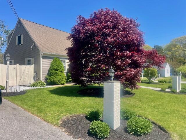 2 Spinning Brook Rd, South Yarmouth, MA 02664 - view of front of home featuring roof with shingles