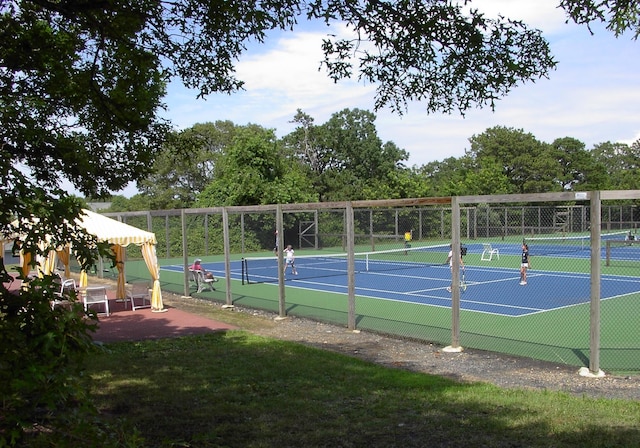 view of sport court with fence