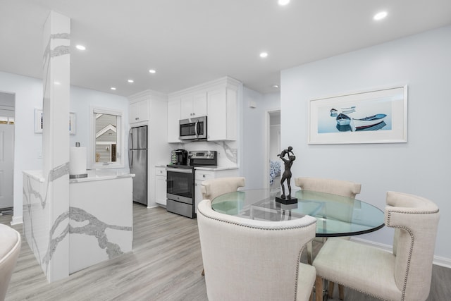 kitchen featuring white cabinetry, recessed lighting, and appliances with stainless steel finishes