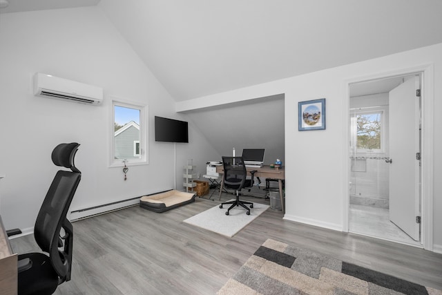 office area featuring vaulted ceiling, wood finished floors, a wall unit AC, and baseboard heating