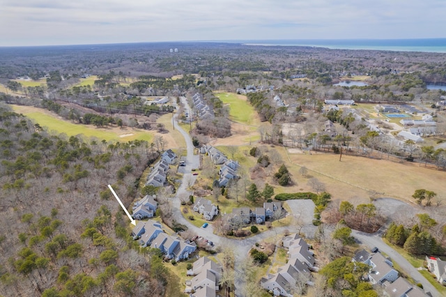 drone / aerial view featuring a residential view and a water view