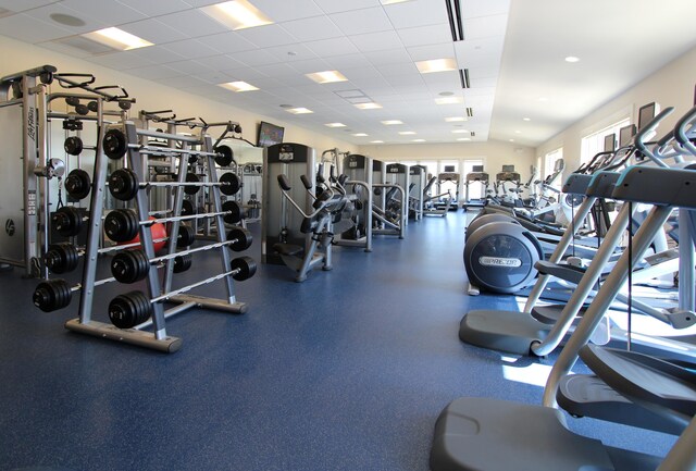 exercise room with a drop ceiling