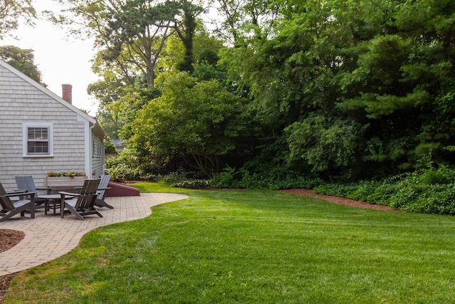 40 Highland Dr, Centerville, MA 02632 - view of grassy yard featuring a patio area