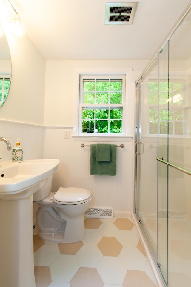 40 Highland Dr, Centerville, MA 02632 - full bathroom with a wainscoted wall, a shower stall, and tile patterned floors