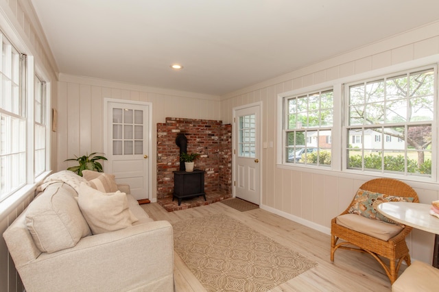 40 Highland Dr, Centerville, MA 02632 - living area with a wood stove, light wood finished floors, crown molding, and recessed lighting