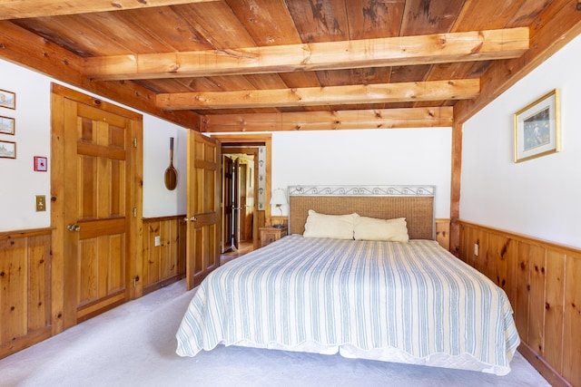 carpeted bedroom with wooden ceiling and beam ceiling