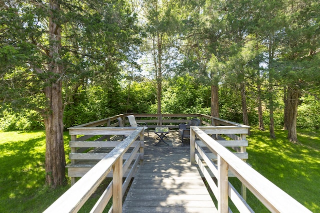 wooden terrace with a yard