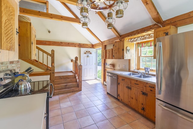 kitchen with stainless steel appliances, sink, lofted ceiling with beams, a chandelier, and light tile patterned floors