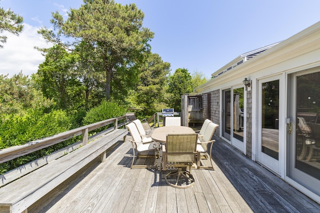 wooden deck featuring grilling area