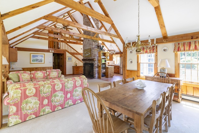 dining space with light carpet, beam ceiling, and a brick fireplace