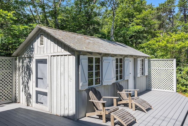 17 Gull Haven Ln, Wellfleet, MA 02667 - wooden terrace featuring an outdoor structure and view of wooded area