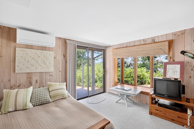 17 Gull Haven Ln, Wellfleet, MA 02667 - bedroom featuring a wall unit AC, wood walls, access to outside, and carpet floors