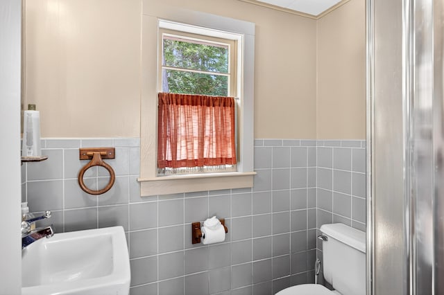 17 Gull Haven Ln, Wellfleet, MA 02667 - bathroom with tile walls, an enclosed shower, and a wainscoted wall