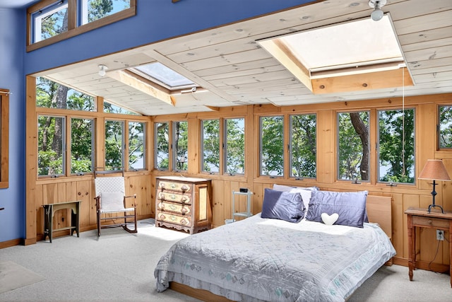 17 Gull Haven Ln, Wellfleet, MA 02667 - bedroom featuring a skylight, carpet flooring, wood walls, and wooden ceiling
