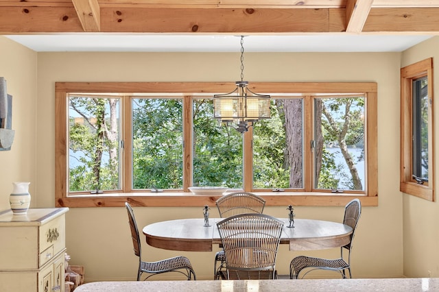 17 Gull Haven Ln, Wellfleet, MA 02667 - dining area with plenty of natural light, a chandelier, and beamed ceiling