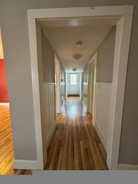 corridor featuring wood-type flooring