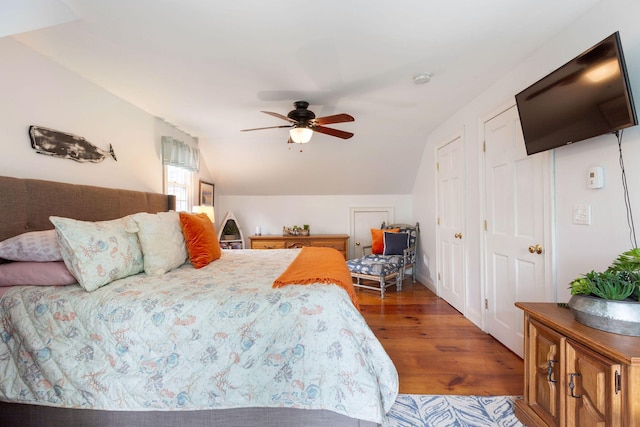 33 Rogers Rd, Brewster, MA 02631 - bedroom with wood finished floors, vaulted ceiling, ceiling fan, and multiple closets