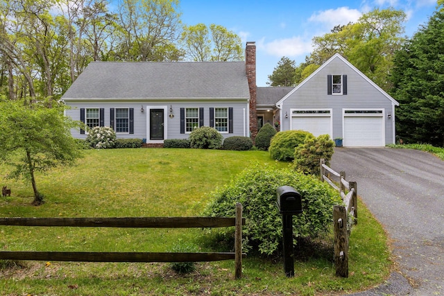 33 Rogers Rd, Brewster, MA 02631 - cape cod home featuring driveway, a chimney, and a garage