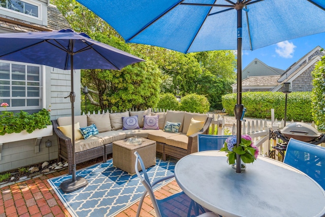 deck with area for grilling, an outdoor living space, and a patio area