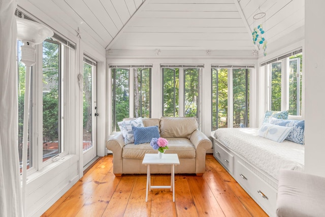 sunroom / solarium featuring lofted ceiling