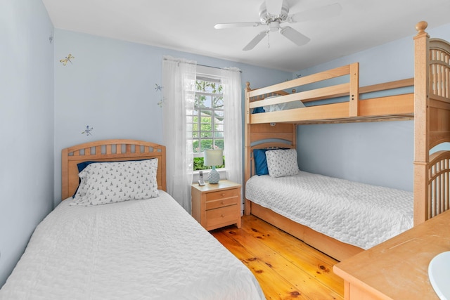 bedroom featuring ceiling fan and wood-type flooring