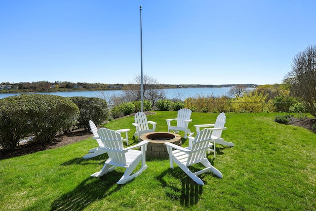 23 Oyster Pond Ln, Chatham, MA 02633 - view of grassy yard featuring a fire pit and a water view