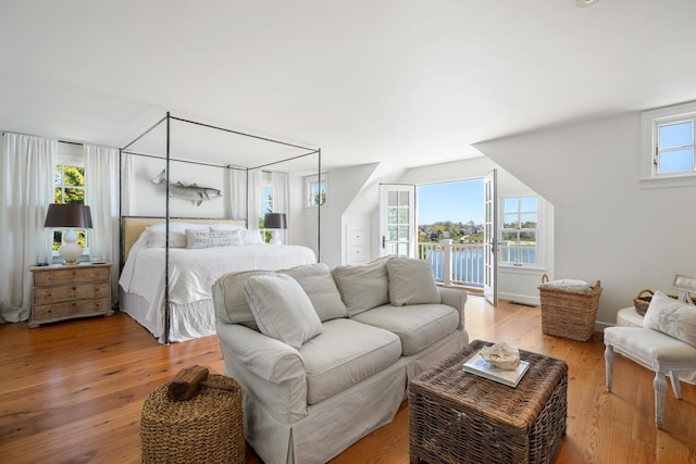 23 Oyster Pond Ln, Chatham, MA 02633 - bedroom with a water view and light wood finished floors