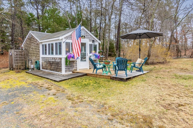 exterior space featuring a lawn and an outbuilding