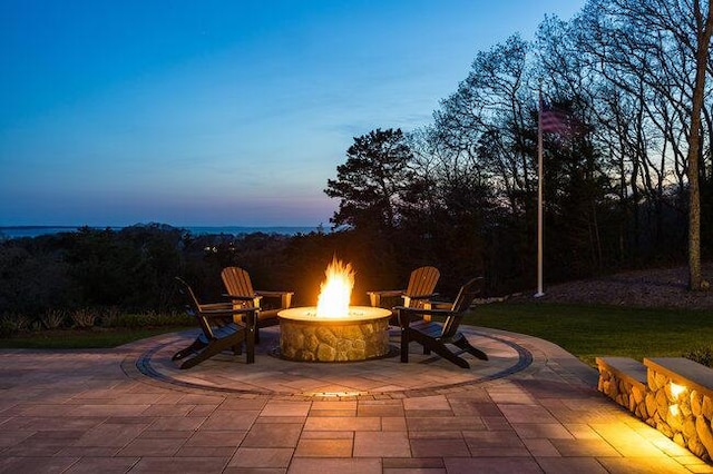 patio terrace at dusk with a fire pit