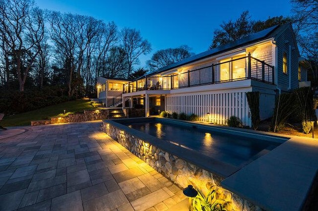 pool featuring a patio area