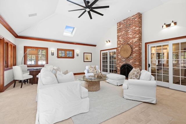 40 Leilla Rich Dr, Wellfleet, MA 02667 - living area featuring a skylight, a brick fireplace, a ceiling fan, light tile patterned floors, and high vaulted ceiling