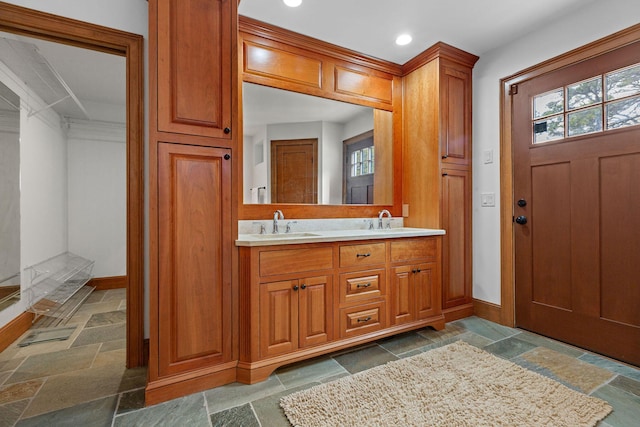 40 Leilla Rich Dr, Wellfleet, MA 02667 - bathroom featuring stone tile flooring, baseboards, recessed lighting, and double vanity