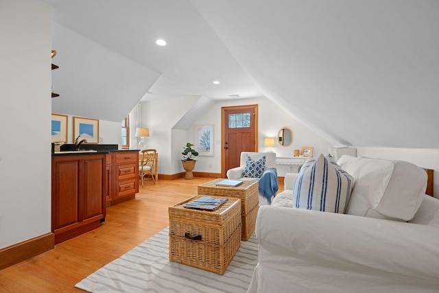 40 Leilla Rich Dr, Wellfleet, MA 02667 - bedroom with baseboards, light wood finished floors, vaulted ceiling, a sink, and recessed lighting