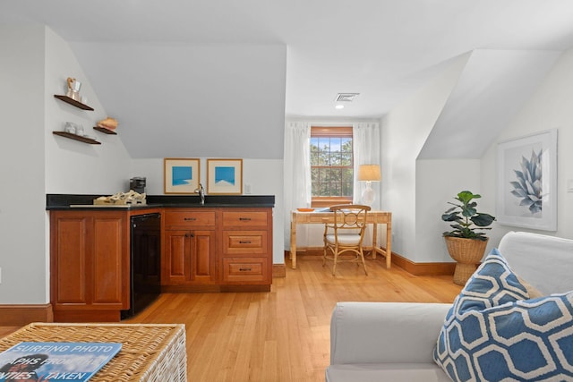 40 Leilla Rich Dr, Wellfleet, MA 02667 - indoor wet bar featuring light wood-style flooring, dishwasher, lofted ceiling, and baseboards