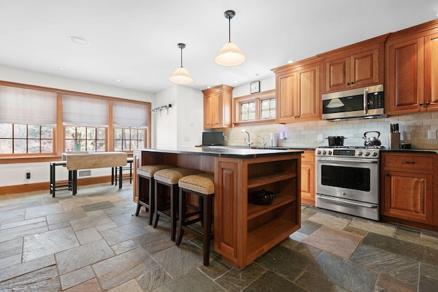 40 Leilla Rich Dr, Wellfleet, MA 02667 - kitchen with appliances with stainless steel finishes, stone tile floors, open shelves, backsplash, and recessed lighting