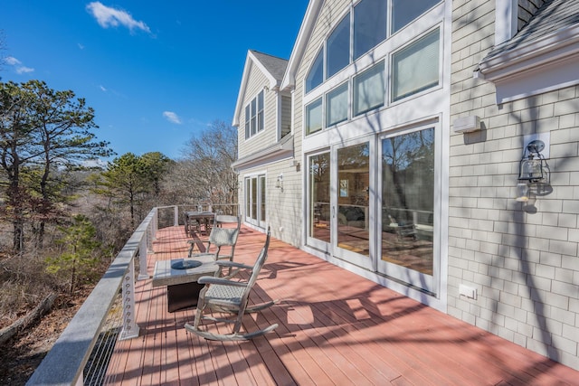 wooden deck with outdoor dining space