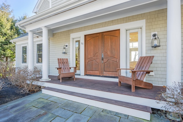 property entrance with covered porch