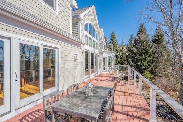 wooden deck with outdoor dining area