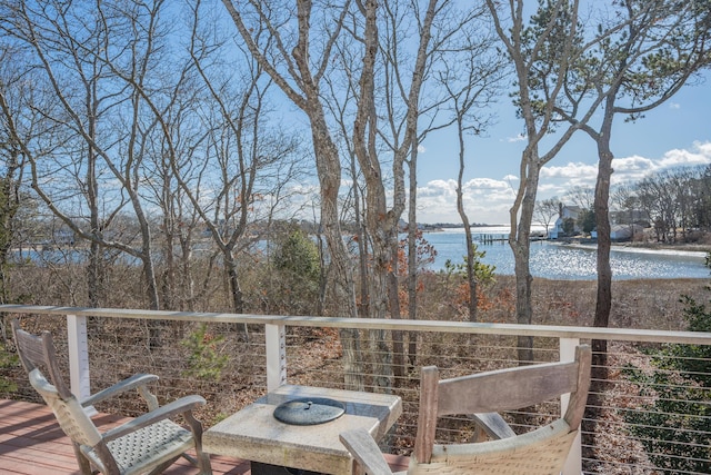 deck featuring a water view